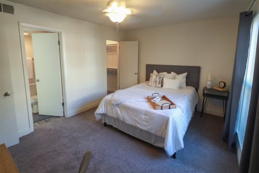 Photo of the bedroom in a 692 square foot 1 bed, 1 bath model aprtment at Cambridge Court Apartments in Dallas Texas