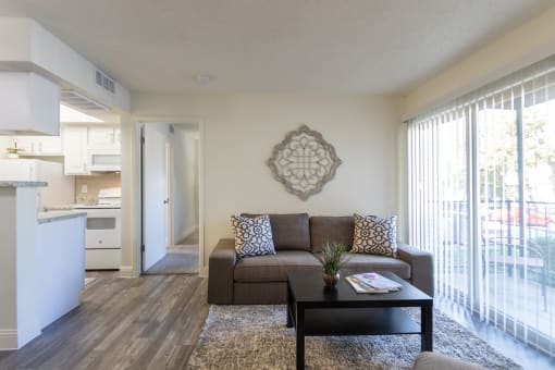 This is a photo of the living room of the 515 square foot 1 bedroom apartment at Canyon Creek Apartments in Dallas, TX