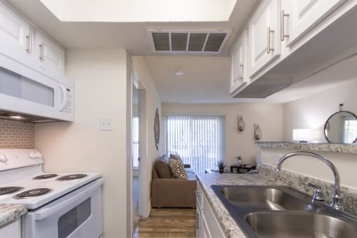 This is a photo of the kitchen of the 515 square foot 1 bedroom apartment at Canyon Creek Apartments in Dallas, TX