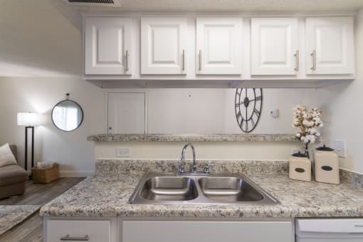 This is a photo of the kitchen of the 515 square foot 1 bedroom apartment at Canyon Creek Apartments in Dallas, TX