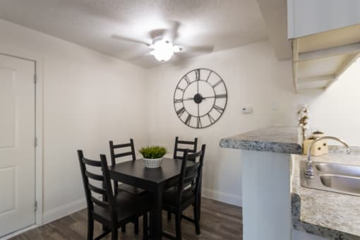 This is a photo of the dining area of the 515 square foot 1 bedroom apartment at Canyon Creek Apartments in Dallas, TX