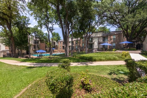 This is a photo of building exteriors/grounds at Canyon Creek Apartments in Dallas, TX.