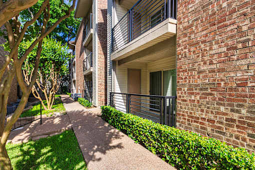 Apartment building exterior at Canyon Creek Apartments in the Dallas Midtown neighborhood of Dallas, TX.