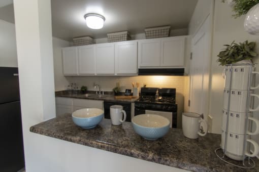 This is a photo of the kitchen in the 740 square foot 1 bedroom model apartment at Compton Lake Apartments in Mt. Healthy, OH.