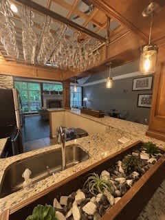 A kitchen with a sink and a counter.