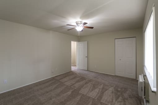 This is a photo of the primary bedroom of the 1004 square foot, 2 bedroom/1 bath Townhome with stackable washer/dryer floor plan at Colonial Ridge Apartments in the Pleasant Ridge neighborhood of Cincinnati, OH.