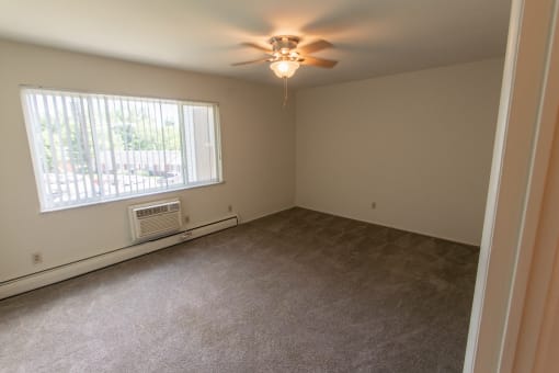 This is a photo of the primary bedroom in the 1004 square foot, 2 bedroom townhome floor plan at Colonial Ridge Apartments in the Pleasant Ridge neighborhood of Cincinnati, OH.