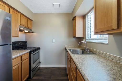 This is a photo of the kitchen of an upgraded 650 square foot, 1 bedroom apartment at Deer Hill Apartments in Cincinnati, OH.