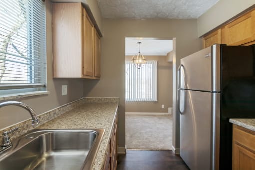 This is a photo of the kitchen of an upgraded 650 square foot, 1 bedroom apartment at Deer Hill Apartments in Cincinnati, OH.
