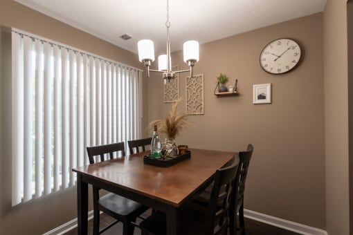 This is a photo of the dining room in the upgraded 650 square foot, 1 bedroom, 1 bath model apartment at Deer Hill Apartments in Cincinnati, Ohio.