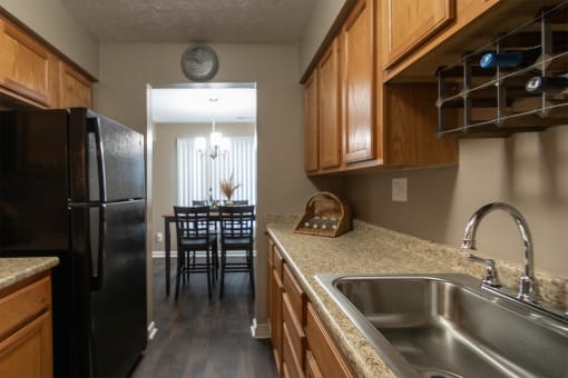 This is a photo of the kitchen in the upgraded 650 square foot, 1 bedroom, 1 bath model apartment at Deer Hill Apartments in Cincinnati, Ohio.