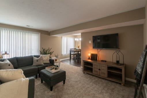 This is a photo of the living room in the upgraded 650 square foot, 1 bedroom, 1 bath model apartment at Deer Hill Apartments in Cincinnati, Ohio.
