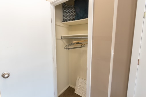 This is a photo of the living room closet in the upgraded 650 square foot, 1 bedroom model apartment at Deer Hill Apartments in Cincinnati, Ohio.