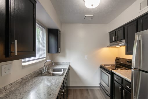 This is a photo of the kitchen in an upgraded 950 square foot, 2 bedroom apartment at Deer Hill Apartments in Cincinnati, OH.