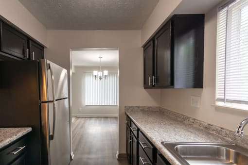 This is a photo of the kitchen in an upgraded 950 square foot, 2 bedroom apartment at Deer Hill Apartments in Cincinnati, OH.