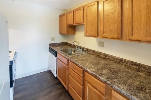 This is a photo of the kitchen in a 950 square foot, standard 2 bedroom apartment at Deer Hill Apartments in Cincinnati, OH.