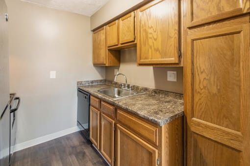This is a photo of the kitchen of an upgraded 950 square foot, 2 bedroom apartment at Deer Hill Apartments in Cincinnati, OH.