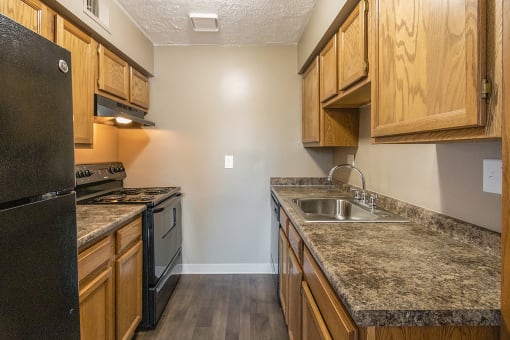 This is a photo of the kitchen of an upgraded 950 square foot, 2 bedroom apartment at Deer Hill Apartments in Cincinnati, OH.