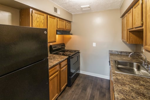 This is a photo of the kitchen of an upgraded 950 square foot, 2 bedroom apartment at Deer Hill Apartments in Cincinnati, OH.