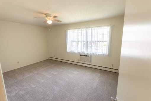 This is a photo of the primary bedroom in the 1004 square foot, 2 bedroom, 1.5 bath townhome floor plan at Lake of the Woods Apartments in Cincinnati, OH.