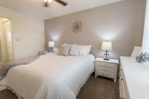 This is a photo of the bedroom of the 1 bedroom, 631 square foot model apartment at Lake of the Woods Apartments in Cincinnati, OH.