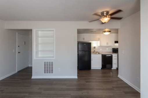 This is a photo of the living room kitchen in an upgraded 500 square foot 1 bedroom, 1 bath Cedar floor plan at Montana Valley Apartments in Cincinnati, OH.