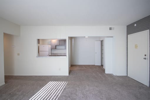This is a photo the kitchen and dining room from the living room of the 833 square foot Chestnut, 2 bedroom apartment at Montana Valley Apartments in Cincinnati, OH.
