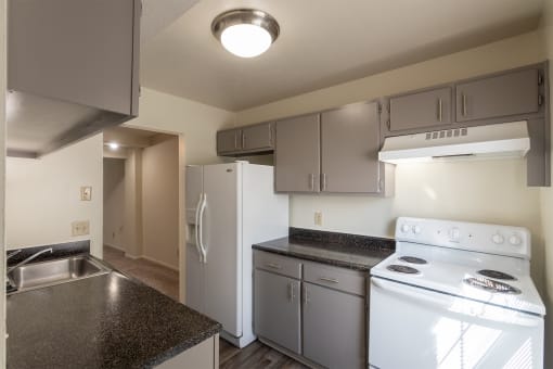 This is a photo of the kitchen of the 1310 square foot 3 bedroom, 1.5 bath Pine floor plan at Montana Valley Apartments in Cincinnati, OH.
