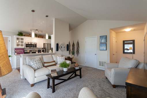 This is a photo of the kitchen from the living room in the 1016 square foot, 2 bedroom, 2 bath Nautica floor plan at Nantucket Apartments in Loveland, OH.