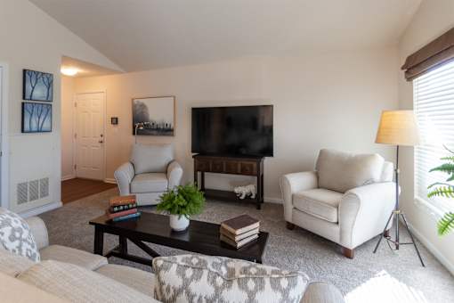This is a photo of the living room in the 1016 square foot, 2 bedroom, 2 bath Nautica floor plan at Nantucket Apartments in Loveland, OH.