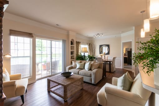 This is a photo of the living room and dining area in the 2 bedroom, 2 bath Islander floor plan at Nantucket Apartments in Loveland, OH.