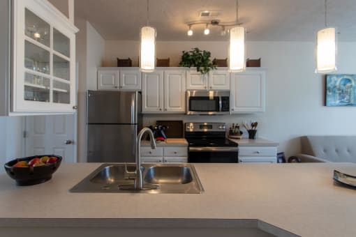 This is a photo of the kitchen in the 1242 square foot, 2 bedroom, 2 and 1/2 bath Spinnaker floor plan at Nantucket Apartments in Loveland, OH.