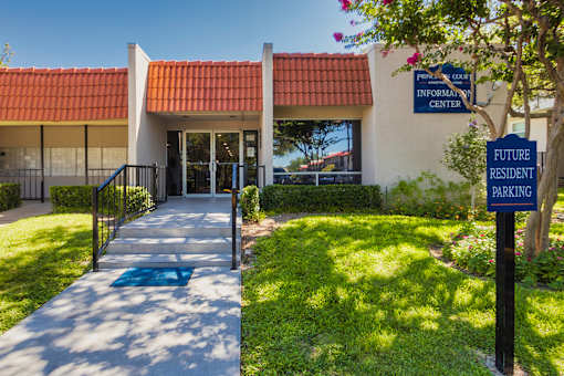 A sign for Princeton Court Information Center is displayed in front of the leasing office at Princeton Court Apartments in the Vickery Midtown neighborhood of Dallas, TX.