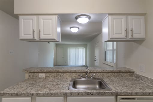 This is a photo of the kitchen in the 963 square foot 2 bedroom, 2 bath apartment at The Summit at Midtown Apartments in Dallas, TX.