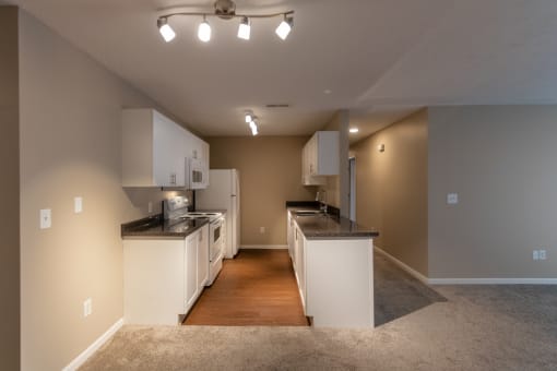 This is a photo of the dining area and kitchen in the 1170 square foot 2 bedroom, 2 bath Freedom Balcony at Washington Place Apartments in Miamisburg, Ohio in Washington Township.