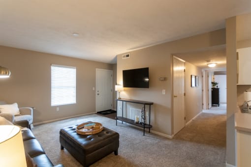 This is a photo of the living room and hallway of the 890 square foot 2 bedroom, 2 bath Liberty at Washington Place Apartments in in Miamisburg, Ohio in Washington Township.