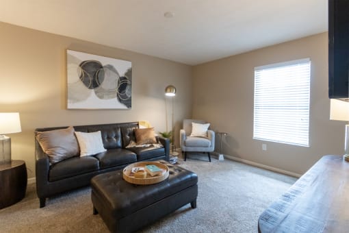 This is a photo of the living room of the 890 square foot 2 bedroom, 2 bath Liberty at Washington Place Apartments in in Miamisburg, Ohio in Washington Township.