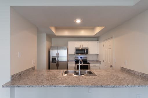 This is a photo of the kitchen of the 1500 square foot 3 bedroom, 2 and a half bath with 2-car garage Bellbrook floor plan at Washington Park Apartments in Centerville, OH.