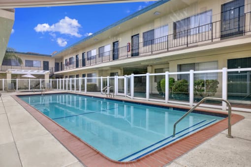 the swimming pool at our hotel in a city at Olive Tree Apartments, California, 90503