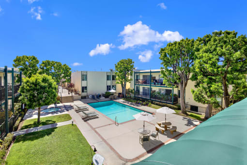 a view of the pool at an apartment building with a swimming pool at Copa Ladeene Apartments, California, 90505