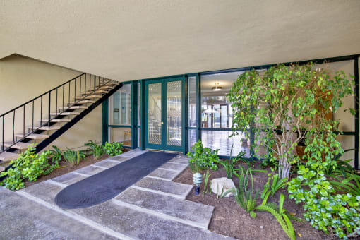 a courtyard with a skateboard on the ground and a staircase at Copa Triana Apartments, Torrance, CA 90505