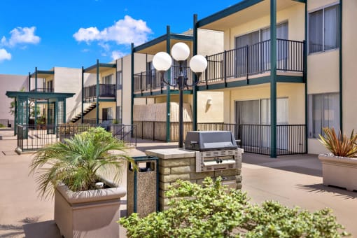 our apartments have a patio with a grill and a heater at Copa Triana Apartments, California