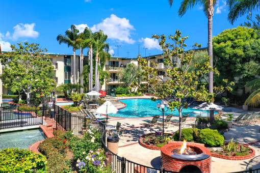 a view of a swimming pool at the resort on a sunny day at Willow Tree Apartments, California