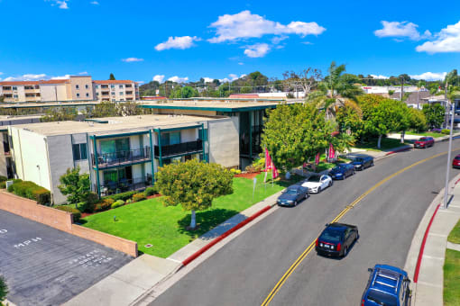 an aerial view of a building with cars parked in front of it at Casa Del Amo Apartments, California