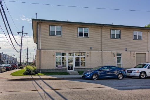 a building with cars parked in front of it