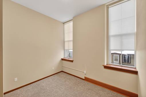 Empty room with a window on the right side.