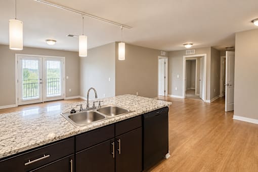 A kitchen with a sink and cabinets.