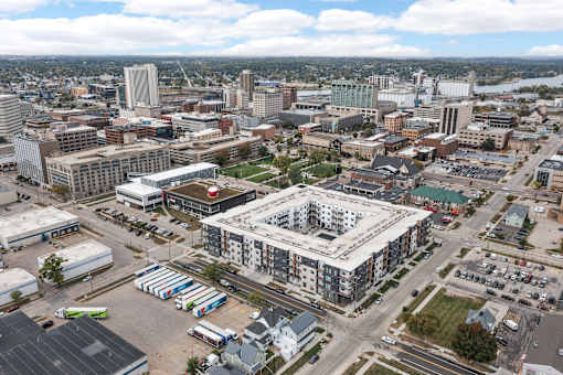 A cityscape with a large building in the center.
