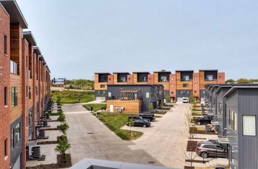 a row of new apartment buildings on a city street at 5Fifty5, Des Moines Iowa  