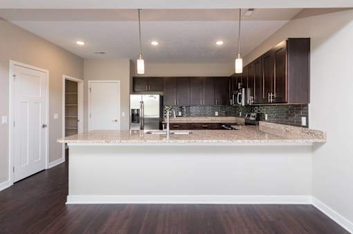 a kitchen with a counter top at 5Fifty5, Iowa, 50309